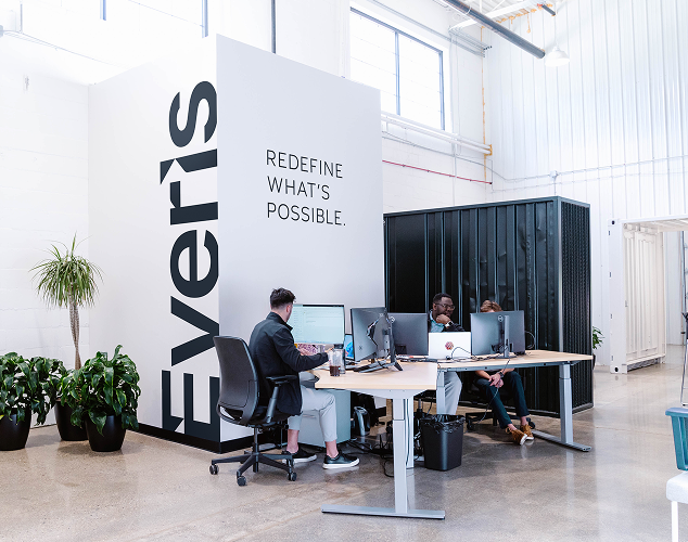 Everis branding along the wall. "Redefine what's possible."